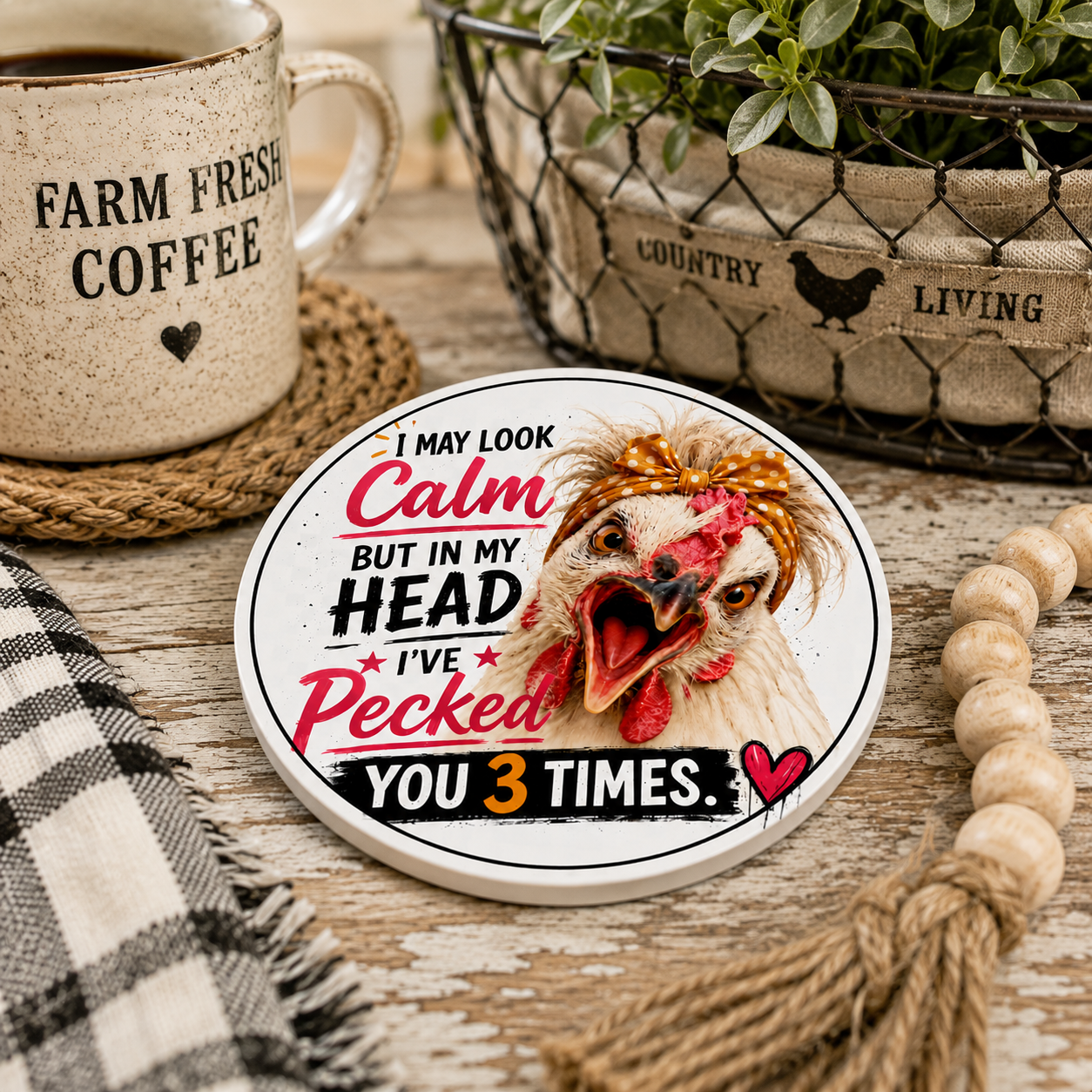 Funny chicken ceramic coaster displayed in a cozy farmhouse kitchen with a coffee mug, greenery, and rustic home décor. The Lucy & Friends™ design adds farmhouse charm and humor to coffee breaks and everyday living.
