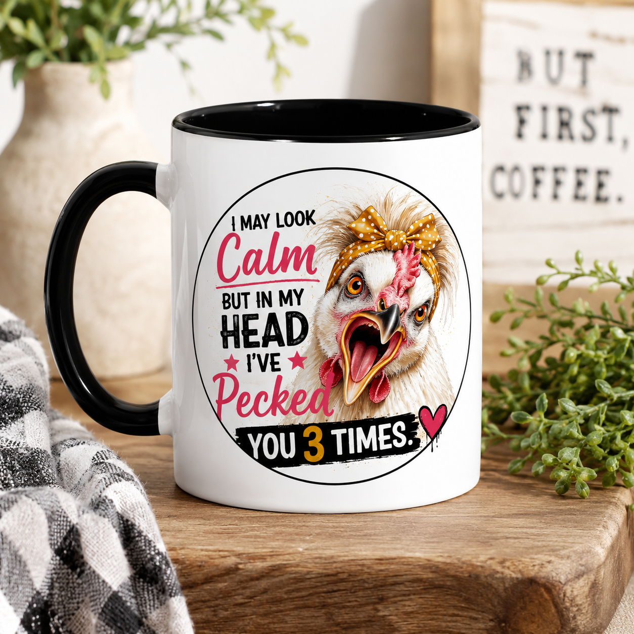 White 15 oz ceramic mug with black handle featuring Lucy the Silkie chicken and the humorous saying "I May Look Calm But In My Head I've Pecked You 3 Times," displayed on a rustic farmhouse table.